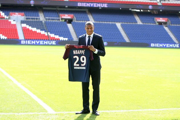 PARIS, FRANCE - SEPTEMBER 6: Kylian Mbappe is presented as new player of Paris Saint Germain by President of PSG Nasser Al Khelaifi at Parc des Princes on September 6, 2017 in Paris, France. (Photo by Jean Catuffe/Getty Images)