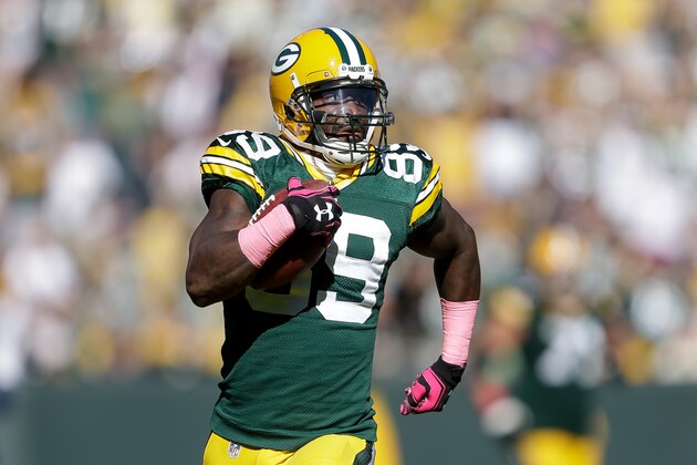 GREEN BAY, WI - OCTOBER 11:  James Jones #89 of the Green Bay Packers runs the football in for a touchdown against the St. Louis Rams in the third quarter on a 65 yard pass from quarterback  Aaron Rodgers #12 at Lambeau Field on October 11, 2015 in Green Bay, Wisconsin.  (Photo by Mike McGinnis/Getty Images)