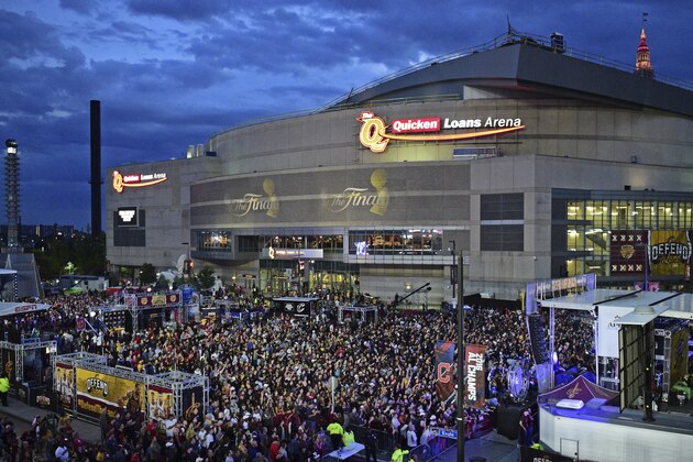 Cleveland Cavaliers fans stand during a watch party outside Quicken Loans Arena during Game 4 of the basketball's NBA Finals between the Cavaliers and the Golden State Warriors, Friday, June 9, 2017, in Cleveland. (AP Photo/David Dermer)