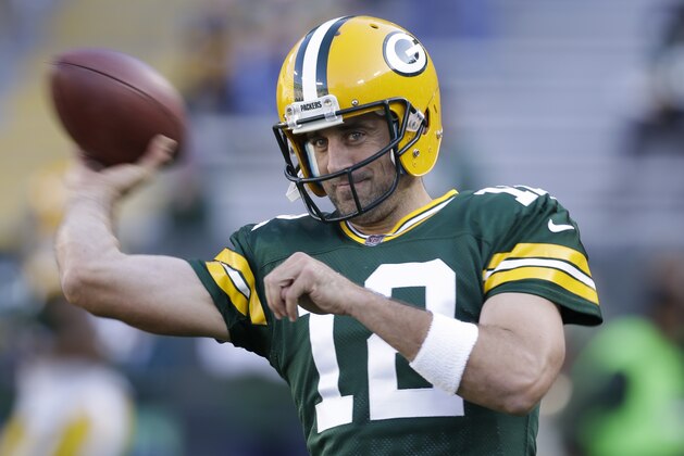 FILE - In this Aug. 31, 2017, file photo, Green Bay Packers' Aaron Rodgers warms up before a preseason NFL football game against the Los Angeles Rams, in Green Bay, Wis. The Green Bay Packers head into the season with familiar expectations as a favorite again to win the NFC North and get to the Super Bowl. Goals will always be set high especially with quarterback Aaron Rodgers in his prime. (AP Photo/Jeffrey Phelps, File)