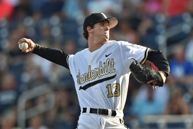 OMAHA, NE - JUNE 24  Pitcher Walker Buehler #13 of the Vanderbilt Commodores delivers a pitch against the Virginia Cavaliers in the first inning during game three of the College World Series Championship Series on June 24, 2015 at TD Ameritrade Park in Omaha, Nebraska.  (Photo by Peter Aiken/Getty Images)