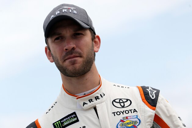 DARLINGTON, SC - SEPTEMBER 02:  Daniel Suarez, driver of the #19 ARRIS Toyota, stands on the grid during qualifying for the Monster Energy NASCAR Cup Series Bojangles' Southern 500 at Darlington Raceway on September 2, 2017 in Darlington, South Carolina.  (Photo by Brian Lawdermilk/Getty Images)