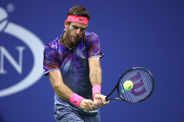 NEW YORK, NY - SEPTEMBER 06:  Juan Martin del Potro of Argentina returns a shot against Roger Federer of Switzerland during their Men's Singles Quarterfinal match on Day Ten of the 2017 US Open at the USTA Billie Jean King National Tennis Center on September 6, 2017 in the Flushing neighborhood of the Queens borough of New York City.  (Photo by Clive Brunskill/Getty Images)