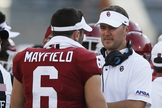 Oklahoma head coach Lincoln Riley, right, talks with quarterback Baker Mayfield (6) during an NCAA college football game between UTEP and Oklahoma in Norman, Okla., Saturday, Sept. 2, 2017. (AP Photo/Sue Ogrocki)