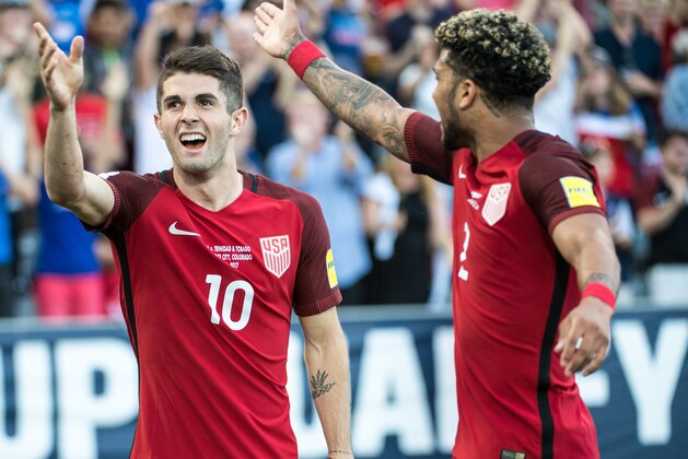 COMMERCE CITY, CO - JUNE 8:  Christian Pulisic #10 of United States celebrates his first goal with DeAndre Yedlin #2 of United States during the World Cup Qualifier match between the United States and Trinidad & Tobago at Dick's Sporting Goods Park on June 8, 2017 in Commerce City, Colorado.  The United States won the match 2-0 (Photo by Shaun Clark/Getty Images)