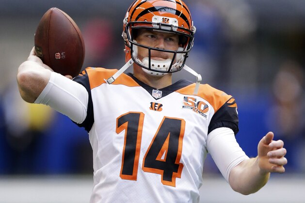 FILE - In this Thursday, Aug. 31, 2017, file photo, Cincinnati Bengals quarterback Andy Dalton warms up before a preseason NFL football game against the Indianapolis Colts in Indianapolis. The Bengals first regular season game is scheduled against the Baltimore Ravens on Sunday, Sept. 10. (AP Photo/Michael Conroy, File)
