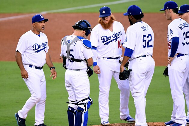 LOS ANGELES, CA - SEPTEMBER 04:  Manager Dave Roberts #30 of the Los Angeles Dodgers removes Pedro Baez #52 from the game during the seventh inning against the Arizona Diamondbacks at Dodger Stadium on September 4, 2017 in Los Angeles, California.  (Photo by Harry How/Getty Images)