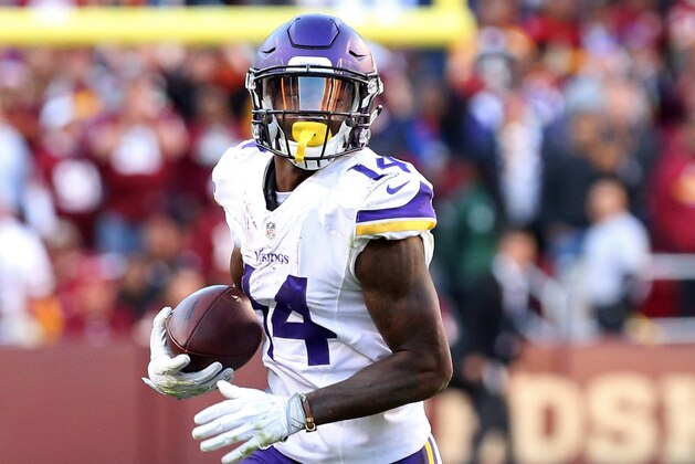 Nov 13, 2016; Landover, MD, USA; Minnesota Vikings wide receiver Stefon Diggs (14) runs with the ball against the Washington Redskins at FedEx Field. Mandatory Credit: Geoff Burke-USA TODAY Sports