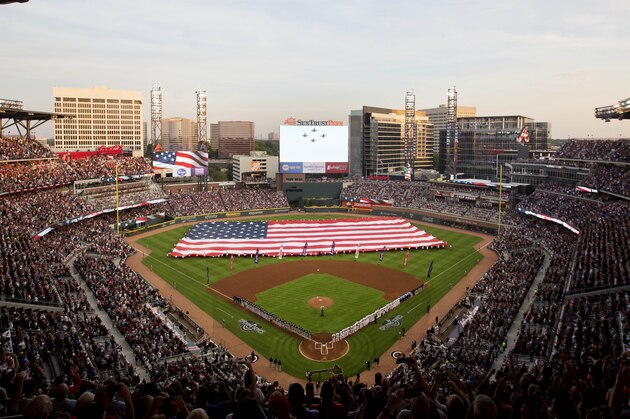 U.S. Navy fighter jets fly over SunTrust Park during the national anthem before a baseball game between the Atlanta Braves and the San Diego Padres in Atlanta, Friday, April 14, 2017. This isn't just another opening day in Atlanta. The Braves are playing their first regular-season game in SunTrust Park, the new stadium that replaced Turner Field. (AP Photo/David Goldman)
