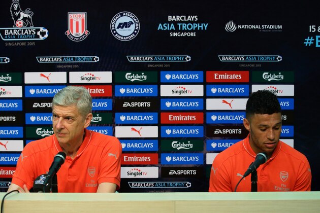 SINGAPORE - JULY 15:  Arsenal team manager, Arsene Wenger and Alex Oxlade-Chamberlain attends the Barclays Asia Trophy post match conference between Arsenal and Singapore Select XI at National Stadium on July 15, 2015 in Singapore.  (Photo by Suhaimi Abdullah/Getty Images)