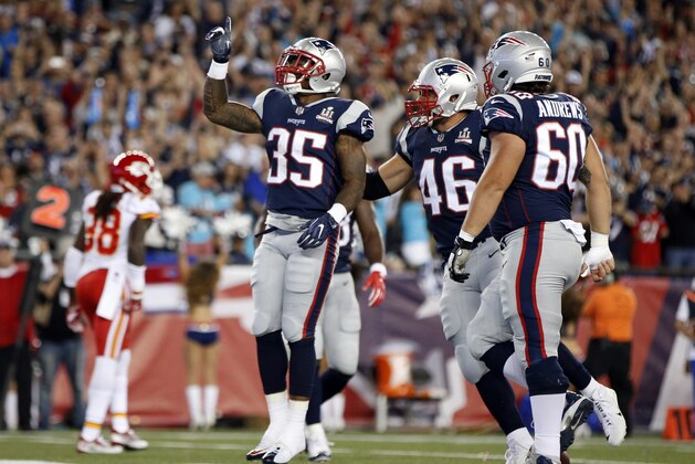 New England Patriots running back Mike Gillislee (35) celebrates his touchdown with James Develin (46) and David Andrews (60) during the first half of an NFL football game against the Kansas City Chiefs on Thursday, Sept. 7, 2017, in Foxborough, Mass. (AP Photo/Michael Dwyer)