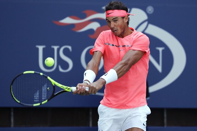 Rafael Nadal, of Spain, returns a shot to Alexandr Dolgopolov, of Ukraine, during the fourth round of the U.S. Open tennis tournament, Monday, Sept. 4, 2017, in New York. (AP Photo/Julie Jacobson)