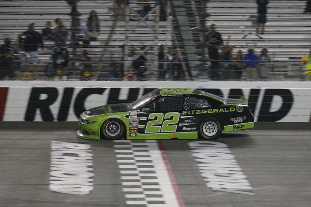 Brad Keselowski crosses the finish line to win the NASCAR Xfinity Series auto race at Richmond International Raceway in Richmond, Va., Friday, Sept. 8, 2017. (AP Photo/Steve Helber)