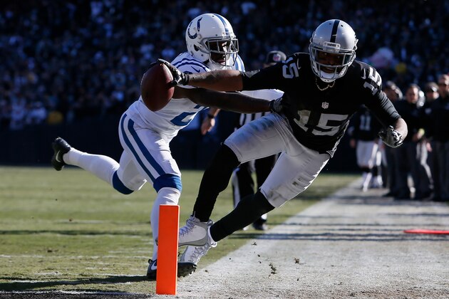 OAKLAND, CA - DECEMBER 24:  Michael Crabtree #15 of the Oakland Raiders dives short of the goal line during their NFL game against the Indianapolis Colts at Oakland Alameda Coliseum on December 24, 2016 in Oakland, California.  (Photo by Brian Bahr/Getty Images)