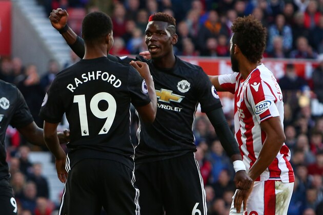 Manchester United's French midfielder Paul Pogba (C) celebrates after his header deflected off Manchester United's English striker Marcus Rashford (L) into the goal during the English Premier League football match between Stoke City and Manchester United at the Bet365 Stadium in Stoke-on-Trent, central England on September 9, 2017. / AFP PHOTO / Geoff CADDICK / RESTRICTED TO EDITORIAL USE. No use with unauthorized audio, video, data, fixture lists, club/league logos or 'live' services. Online in-match use limited to 75 images, no video emulation. No use in betting, games or single club/league/player publications.  /         (Photo credit should read GEOFF CADDICK/AFP/Getty Images)