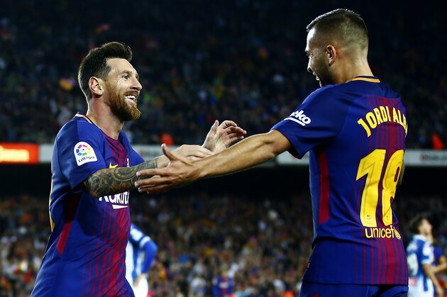 FC Barcelona's Lionel Messi, left, celebrates with his teammate Jordi Alba after scoring during the Spanish La Liga soccer match between FC Barcelona and Espanyol at the Camp Nou stadium in Barcelona, Spain, Saturday, Sept. 9, 2017. (AP Photo/Manu Fernandez)