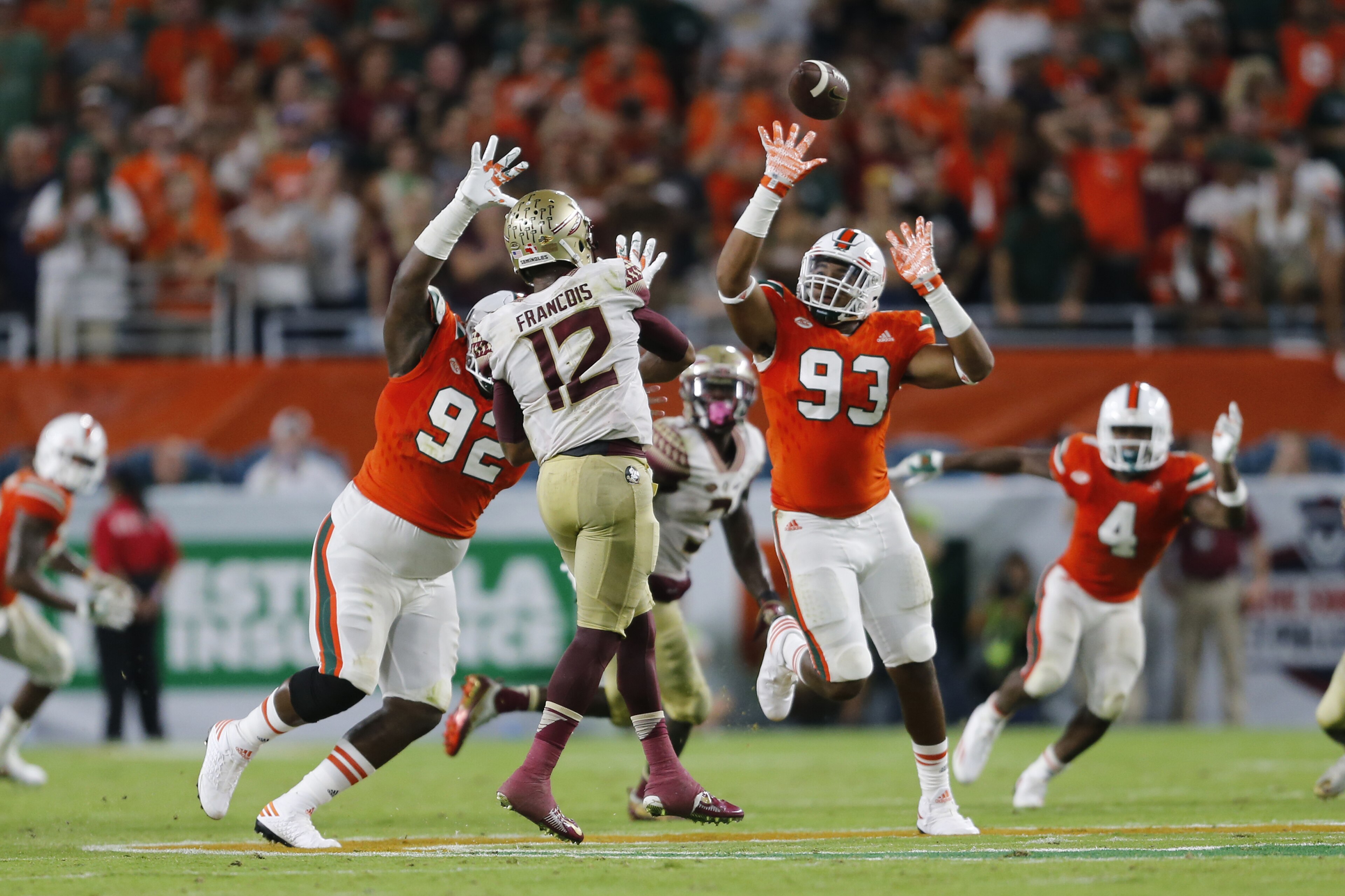 MIAMI GARDENS, FL - OCTOBER 8: Pat Bethel #93 of the Miami Hurricanes is unable to tip the pass thrown by Deondre Francois #12 of the Florida State Seminoles during fourth quarter action on October 8, 2016 at Hard Rock Stadium in Miami Gardens, Florida. Florida State defeated Miami 20-19. Photo by Joel Auerbach/Getty Images)