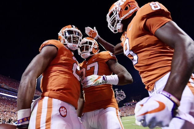 CLEMSON, SC - SEPTEMBER 09:  Quarterback Kelly Bryant #2, wide receiver Deon Cain #8, and tight end D.J. Greenlee #87 of the Clemson Tigers celebrate following Bryant's touchdown to start the second half of play during the Tigers' game football game against the Auburn Tigers at Memorial Stadium on September 9, 2017 in Clemson, South Carolina. (Photo by Mike Comer/Getty Images)