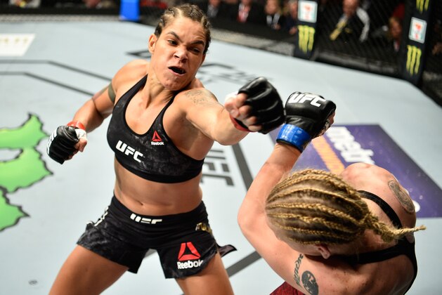 EDMONTON, AB - SEPTEMBER 09:  (L-R) Amanda Nunes of Brazil punches Valentina Shevchenko of Kyrgyzstan in their women's bantamweight bout during the UFC 215 event inside the Rogers Place on September 9, 2017 in Edmonton, Alberta, Canada. (Photo by Jeff Bottari/Zuffa LLC/Zuffa LLC via Getty Images)