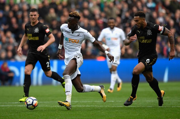 SWANSEA, WALES - SEPTEMBER 10:  Jamaal Lascelles of Newcastle United chases Tammy Abraham of Swansea City during the Premier League match between Swansea City and Newcastle United at Liberty Stadium on September 10, 2017 in Swansea, Wales.  (Photo by Stu Forster/Getty Images)