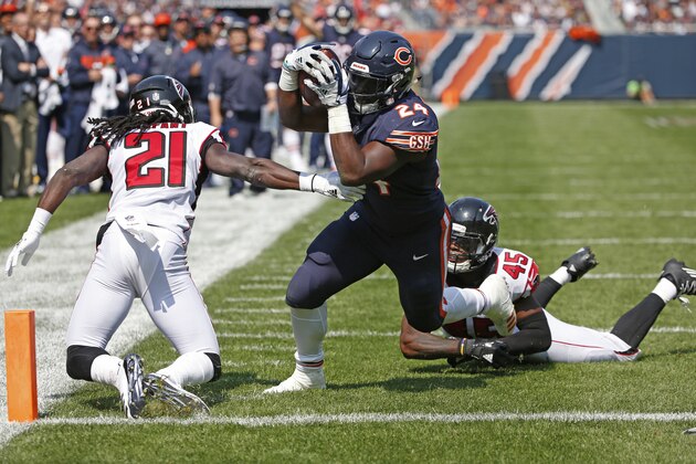 Chicago Bears running back Jordan Howard (24) dives into end zone for a touchdown against Atlanta Falcons cornerback Desmond Trufant (21) and linebacker Deion Jones (45) during the first half of an NFL football game, Sunday, Sept. 10, 2017, in Chicago. (AP Photo/Nam Y. Huh)