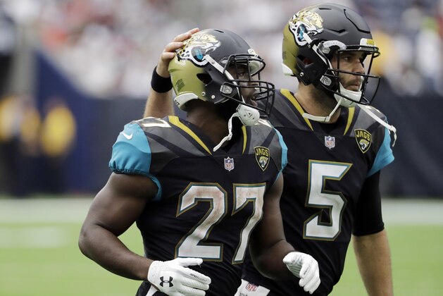 Jacksonville Jaguars running back Leonard Fournette (27) and quarterback Blake Bortles (5) run off the field during the second half of an NFL football game against the Houston Texans Sunday, Sept. 10, 2017, in Houston. (AP Photo/David J. Phillip)