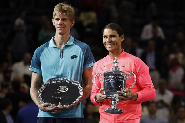 Rafael Nadal, of Spain, right, poses for photos with Kevin Anderson, of South Africa, after winning the men's singles final of the U.S. Open tennis tournament, Sunday, Sept. 10, 2017, in New York.(AP Photo/Andres Kudacki)