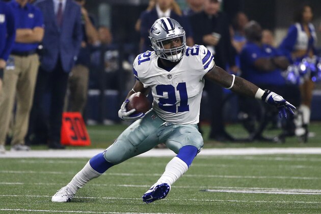 Dallas Cowboys running back Ezekiel Elliott (21) carries the ball for extra yardage against the New York Giants in the second half of an NFL football game, Sunday, Sept. 10, 2017, in Arlington, Texas. (AP Photo/Ron Jenkins)