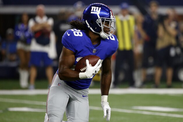New York Giants running back Paul Perkins carries the ball against the Dallas Cowboys in the first half of an NFL football game, Sunday, Sept. 10, 2017, in Arlington, Texas. (AP Photo/Ron Jenkins)