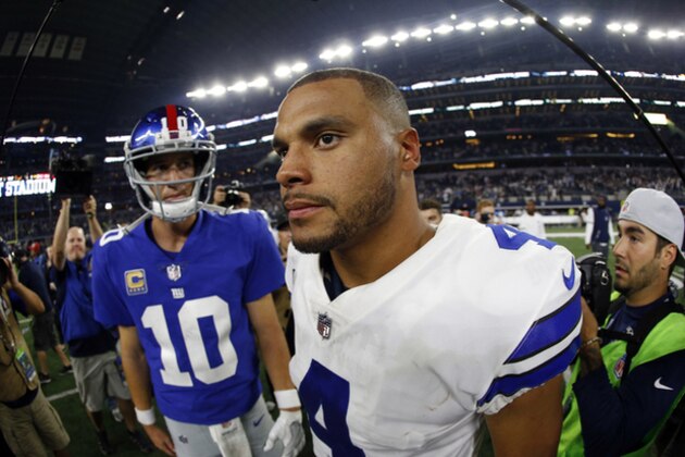 New York Giants' Eli Manning (10) and Dallas Cowboys' Dak Prescott (4) meet at midfield after their NFL football game, Sunday, Sept. 10, 2017, in Arlington, Texas. (AP Photo/Ron Jenkins)
