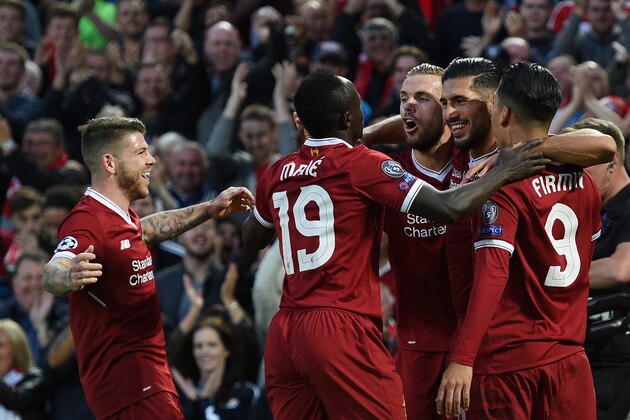 Liverpool's German midfielder Emre Can (2R) celebrates with teammates scoring his team's first goal during the Champions League qualifier, second leg match between Liverpool and Hoffenheim at Anfield stadium in Liverpool on August 23, 2017. / AFP PHOTO / Oli SCARFF        (Photo credit should read OLI SCARFF/AFP/Getty Images)