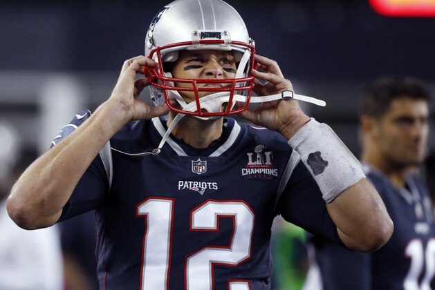 New England Patriots quarterback Tom Brady adjusts his helmet on the sideline during the first half of an NFL football game against the Kansas City Chiefs, Thursday, Sept. 7, 2017, in Foxborough, Mass. The Chiefs defeated the Patriots 42-27. The good news for New England is that the last three times it lost its season opener it went on the win the Super Bowl. (AP Photo/Michael Dwyer)