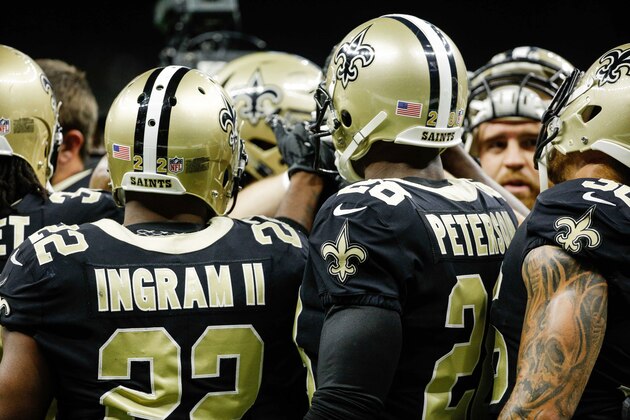 Aug 31, 2017; New Orleans, LA, USA; New Orleans Saints running back Mark Ingram II (22) and running back Adrian Peterson (28) huddle up with teammates before a preseason game against the Baltimore Ravens at the Mercedes-Benz Superdome. Mandatory Credit: Derick E. Hingle-USA TODAY Sports