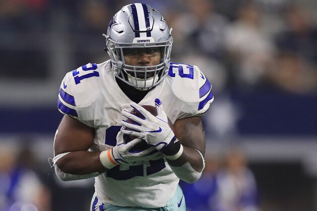 ARLINGTON, TX - SEPTEMBER 10:  Ezekiel Elliott #21 of the Dallas Cowboys runs the ball against the New York Giants at AT&T Stadium on September 10, 2017 in Arlington, Texas.  (Photo by Ronald Martinez/Getty Images)