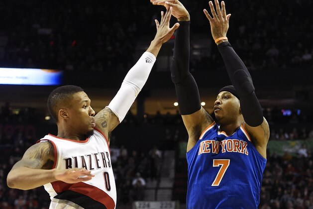 New York Knicks forward Carmelo Anthony (7) shoots over Portland Trail Blazers guard Damian Lillard (0) during the first half of an NBA basketball game in Portland, Ore., Saturday, Dec. 12, 2015. (AP Photo/Steve Dykes)