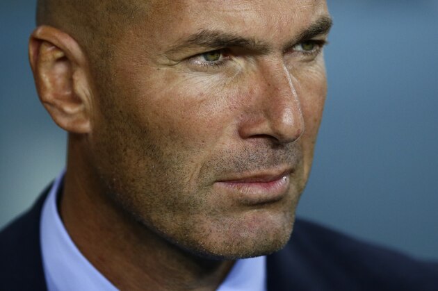 Real Madrid's head coach Zinedine Zidane awaits the start of the Spanish Supercup, first leg, soccer match between FC Barcelona and Real Madrid at the Camp Nou stadium in Barcelona, Spain, Sunday, Aug. 13, 2017. (AP Photo/Manu Fernandez)