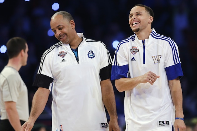 Golden State Warriors' Stephen Curry celebrates with his father, Dell Curry, left, during the NBA All-Star Saturday Shooting Stars event Saturday, Feb. 14, 2015, in New York. (AP Photo/Frank Franklin II)