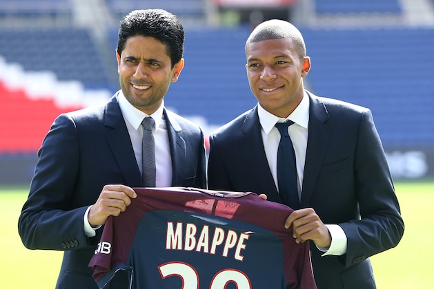 PARIS, FRANCE - SEPTEMBER 6: Kylian Mbappe is presented as new player of Paris Saint Germain by President of PSG Nasser Al Khelaifi at Parc des Princes on September 6, 2017 in Paris, France. (Photo by Jean Catuffe/Getty Images)