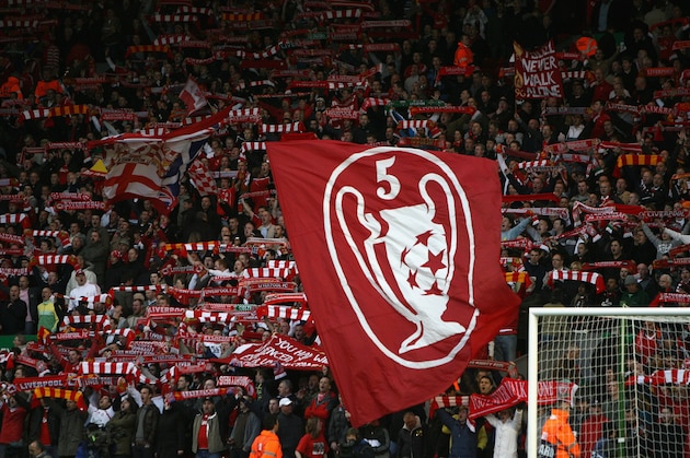 LIVERPOOL, UNITED KINGDOM - APRIL 08:  Supporters on the Kop show off their flags and scarves prior to the UEFA Champions League Quarter Final, second leg match between Liverpool and Arsenal at Anfield on April 8, 2008 in Liverpool, England.  (Photo by Clive Brunskill/Getty Images)