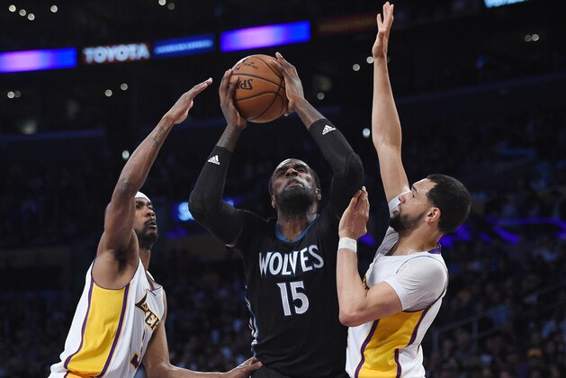 LOS ANGELES, CA - APRIL 9: Shabazz Muhammad #15 of the Minnesota Timberwolves shoots a basket in between Corey Brewer #3 and Tyler Ennis #11 of the Los Angeles Lakers during the first half of the basketball game at Staples Center April 9, 2017, in Los Angeles, California. NOTE TO USER: User expressly acknowledges and agrees that, by downloading and or using this photograph, User is consenting to the terms and conditions of the Getty Images License Agreement. (Photo by Kevork Djansezian/Getty Images)