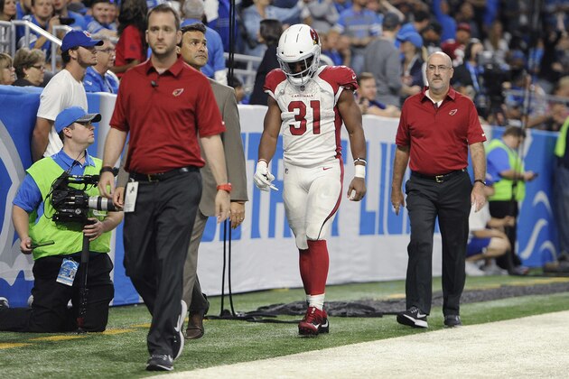 Arizona Cardinals running back David Johnson (31) walks off the field with medical staff for x-rays against the Detroit Lions during an NFL football game in Detroit, Sunday, Sept. 10, 2017. (AP Photo/Jose Juarez)