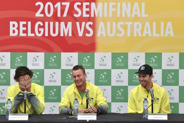 Team Australia's captain Lleyton Hewitt, center, speaks while flanked by Australian players Jordan Thomas, left, and John Peers, right, during a media conference prior to a Davis Cup World Group semi-final tennis match in Brussels, Tuesday, Sept. 12, 2017. Belgium plays a semi-final against Australia beginning Friday, Sept. 15, 2017. (AP Photo/Geert Vanden Wijngaert)