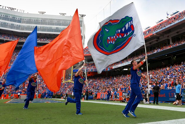 GAINESVILLE, FL - NOVEMBER 12: Florida Gators cheerleaders carry flags after a score during the game against the South Carolina Gamecocks at Ben Hill Griffin Stadium on November 12, 2016 in Gainesville, Florida. (Photo by Rob Foldy/Getty Images)