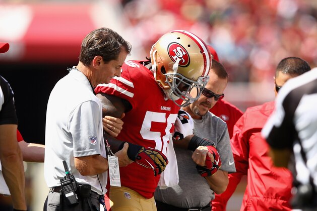SANTA CLARA, CA - SEPTEMBER 10:  Reuben Foster #56 of the San Francisco 49ers is helped off the field after he was injured in their game against the Carolina Panthers at Levi's Stadium on September 10, 2017 in Santa Clara, California.  (Photo by Ezra Shaw/Getty Images)