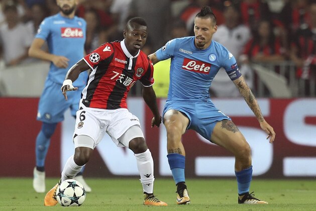 Nice's Ivorian midfielder Jean Seri (L) controls the ball during the UEFA Champions League play-off football match between Nice and Napoli on August 22, 2017 at the Allianz Riviera stadium in Nice, southeastern France.   / AFP PHOTO / VALERY HACHE        (Photo credit should read VALERY HACHE/AFP/Getty Images)