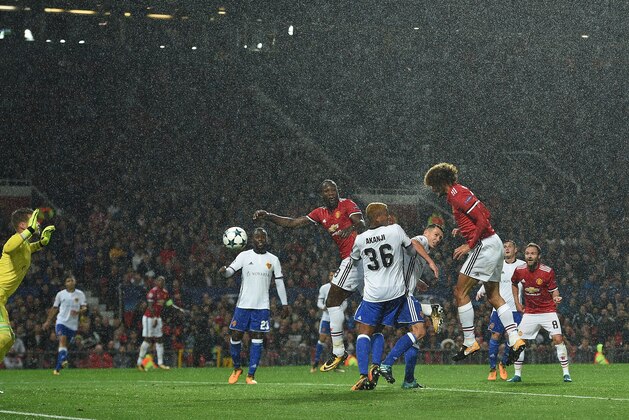 Manchester United's Belgian midfielder Marouane Fellaini (3R) scores the opening goal during the UEFA Champions League Group A football match between Manchester United and Basel at Old Trafford in Manchester, north west England on September 12, 2017. / AFP PHOTO / Oli SCARFF        (Photo credit should read OLI SCARFF/AFP/Getty Images)