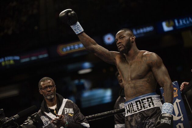 Deontay Wilder raises his glove before his WBC heavyweight title boxing bout against Gerald Washington on Saturday, Feb. 25, 2017, in Birmingham, Ala. Wilder defeated Washington in the 5th round with a TKO. (AP Photo/Albert Cesare)