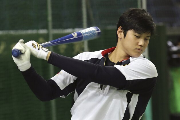 Japan's designated hitter Shohei Otani swings during his team's batting practice prior to an international exhibition series baseball game against the Netherlands at Tokyo Dome in Tokyo, Saturday, Nov. 12, 2016. (AP Photo/Koji Sasahara)