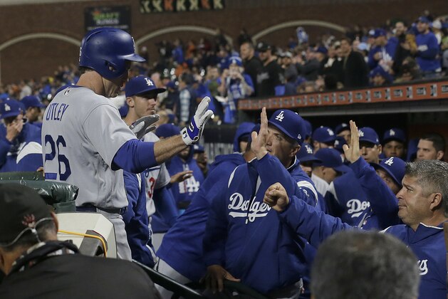 Los Angeles Dodgers' Chase Utley (26) is congratulated after hitting a solo home run against the San Francisco Giants during the fourth inning of a baseball game in San Francisco, Tuesday, Sept. 12, 2017. (AP Photo/Jeff Chiu)