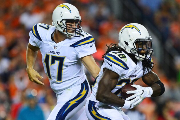 DENVER, CO - SEPTEMBER 11:  Philip Rivers #17 hands the ball off to running back Melvin Gordon #28 of the Los Angeles Chargers in the second quarter of the game against the Denver Broncos at Sports Authority Field at Mile High on September 11, 2017 in Denver, Colorado. (Photo by Dustin Bradford/Getty Images)